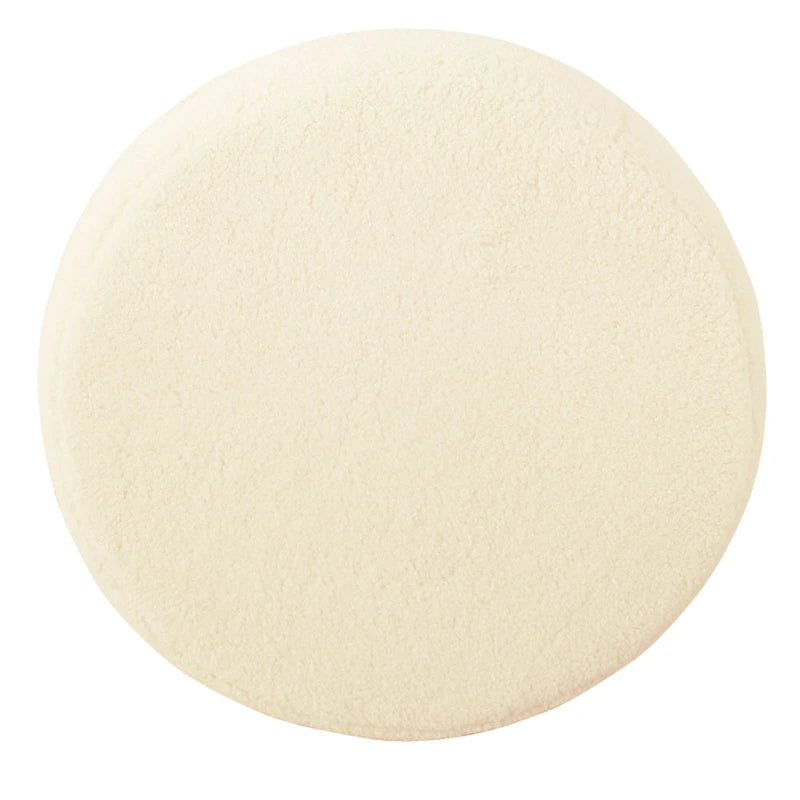 Round Faux Sheepskin Upholstered Ottoman on Matte Black Metal Frame – Cream